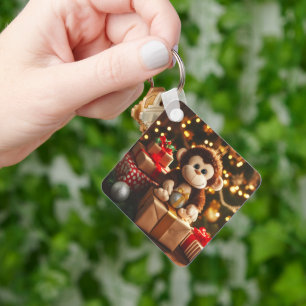 Porte-clés Singe mignon sur un cadeau de Noël