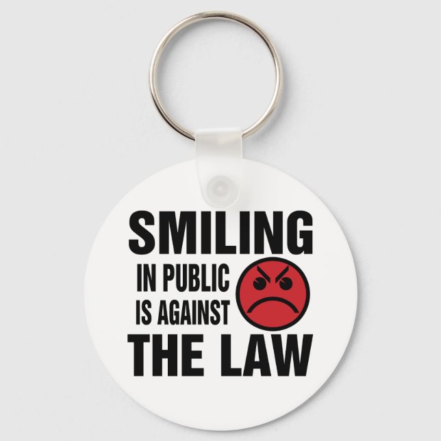 Porte-clés Sourire en public est contre la loi (Recto)