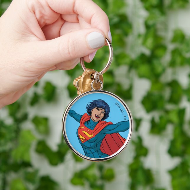 Porte-clés Supergirl volant en costume bleu (Main)