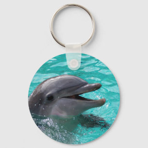 Porte-clés Tête de dauphin dans l'eau bleu vert