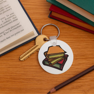 Porte-clés Trois vieux livres empilés ensemble