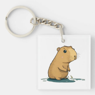 Porte-clés un capybara au trou d'arrosage