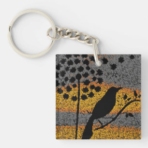 Porte-clés Un oiseau parmi les plumes