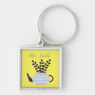 Porte-clés Une théière moderne simple au pastel plante