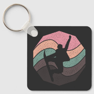 Porte-clés vintage pastel saut skateboarder cascade