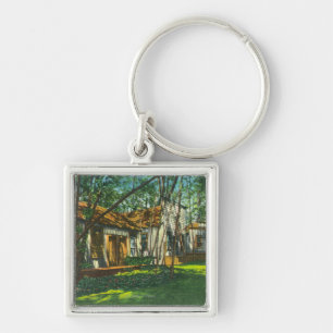 Porte-clés Vue de ville pionnière au grand parc d'arbres