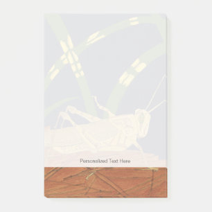 Post-it® Sauterelle dans l'herbe verte sur l'arrière - plan