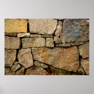 Poster A stone wall made of cobblestones background textu