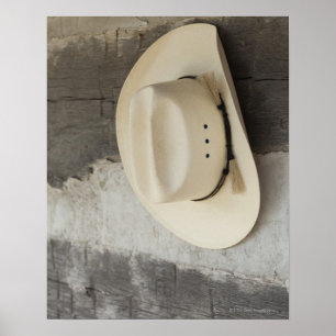 Poster Casquette Cowboy accroché sur le mur du cabine en 