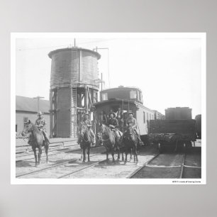 Poster Cowboys à cheval posant devant un train