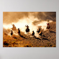 Cowboys chasing wilding horses. roping and riding