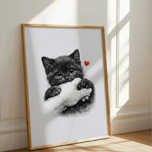 Poster Joli petit chaton noir mordillant la main avec amo