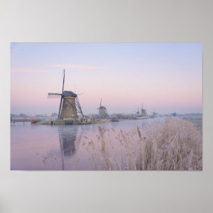Poster Lumière du lever du soleil en hiver sur les moulin