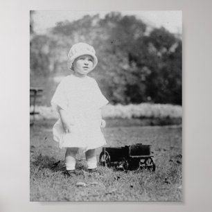 Poster Petite fille avec le chariot de jouet