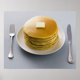 Poster Pile de crêpes avec du beurre d'un plat