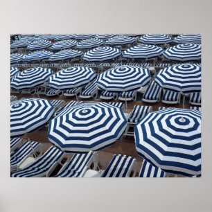Poster Rows of Striped Beach Umbrellas With Sun Beds