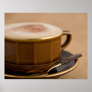 Poster Tasse de cappuccino avec la poudre de cacao