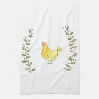 Poule et serviette de cuisine de couleur chamois