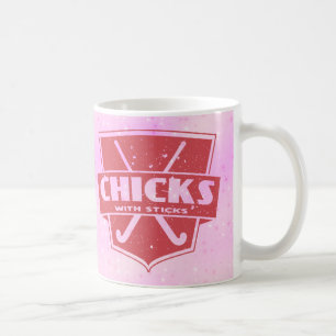 Poussins d'hockey de champ avec la tasse de bâtons