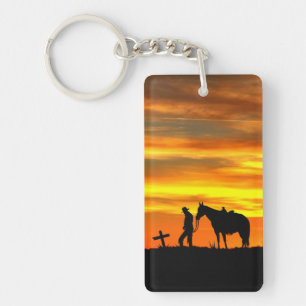 Prière Cowboy avec coucher de soleil