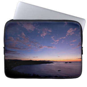 Protection Pour Ordinateur Portable Un coucher du soleil au-dessus de l'océan en le