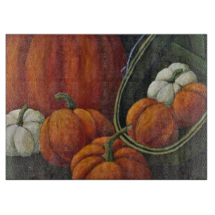 Pumpkins und grüner Korb Schneidebrett