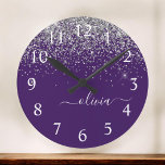 Purple Silver Glitter Girly Glam Monogram  Runde Wanduhr<br><div class="desc">Purple and Silver Sparkle Glitter Brushed Script Monogram Name Clock. This makes the perfect sweet 16 birthday,  wedding,  bridal shower,  anniversary,  baby shower or bachelorette party gift for someone that loves glam luxury and chic styles.</div>