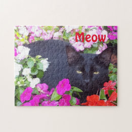 Puzzle Beau chat noir avec les yeux verts en fleurs
