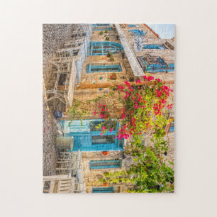 Puzzle Bougainvillea growing up the wall of a restaurant