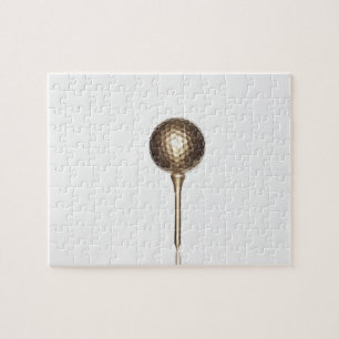 Puzzle Boule et pièce en t de golf d'or