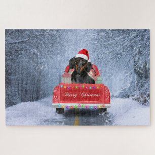 Puzzle Chien de Dachshund en neige assis sur un camion de