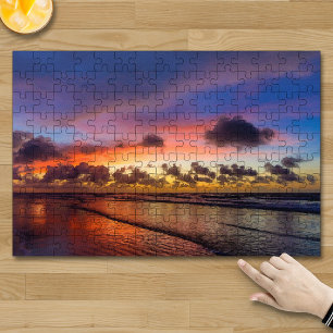 Puzzle Coucher de soleil sur la plage, ciel bleu nuageux