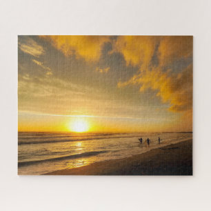 Puzzle Coucher de soleil surfeur sur la plage