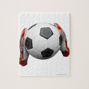 Puzzle Deux gants de gardiens de but tenant un football
