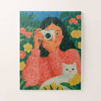 Puzzle Fille avec appareil photo et chat dans un jardin