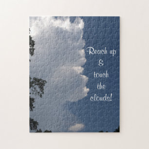 Puzzle Fluffige weiße Wolken und blauer Himmel Spr