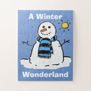 Puzzle Le bonhomme de neige amusant dans un cadre hiverna