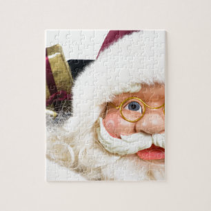 Puzzle Le portrait du père noël font face et des prése