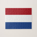 Puzzle mit der Flagge der Niederlande<br><div class="desc">Tauchen Sie ein in die lebendigen Farben der Niederlande mit unserem eindrucksvollen Puzzle unter der Flagge der Niederlande! Dieses mit Präzision erstellte Rätsel zeigt stolz die ikonische Trikolorfahne der Niederlande. Die Flagge besteht aus drei horizontalen Bändern gleicher Größe - oben rot, in der Mitte weiß und unten blau. Diese Farbtöne...</div>