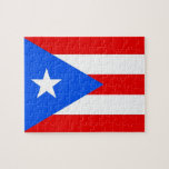 Puzzle mit Flag Puerto Rico Staat<br><div class="desc">Zusammen mit unserem faszinierenden Puzzle mit der lebendigen Flagge der Insel, spielen Sie Ihre Liebe nach Puerto Rico! Beginnen Sie mit einer Entdeckungs- und Feierreise, während Sie dieses sorgfältig gefertigte Puzzle zusammenstellen, jedes Stück mit dem typischen Design der puerto-ricanischen Fahne. Dieses Puzzle mit seinen kühnen Farben Rot, Weiß und Blau...</div>