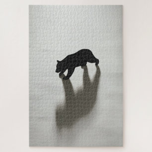 Puzzle Ombre d'ours noir dans une blanche solitude