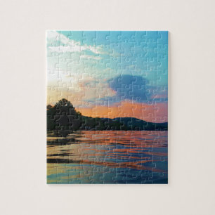 Puzzle Pêche et coucher de soleil sur le lac de montagne