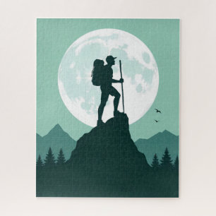 Puzzle Randonneur en silhouette sur un pic avec la lune e