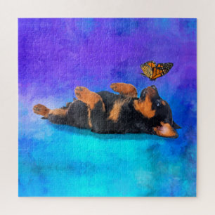 Puzzle Rottweiler - chiot de Metzgerhund avec le papillon