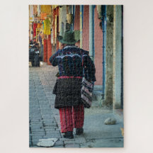 Traditional Man Walking Cobblestone Street