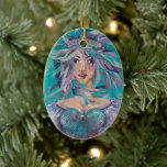 Queen Safine Blue Purple Mermaid Ocean Princess Keramik Ornament<br><div class="desc">Add some mermaid magic to your Christmas tree with this lovely ornament featuring artwork by Artist Susan M. Epperly. This artwork is from a mixed media assemblage titled "Queen Safine" the ninth in Artist Susan M. Epperly's 2021 series titled, “Corona." The original piece incorporates acrylic paints; fabric; ribbon; glass, crystal,...</div>