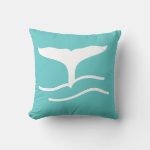 queue de baleine blanche sur coussin bleu turquois