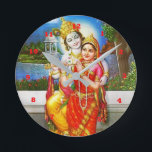 RADHA Krishna Flute Instrument Deity Holy Runde Wanduhr<br><div class="desc">Style: Round (Medium) It's time to show off your favorite art, photos, and text with a custom round wall clock from Zazzle. Featured in two sizes, this wall clock is vibrantly printed with AcryliPrint®HD process to ensure the highest quality display of any content. Order this custom round wall clock for...</div>