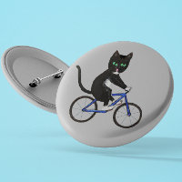 Radkatze auf einem Rad Schwarz-Weiß-Katze