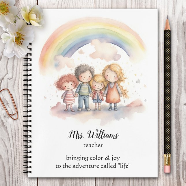 Rainbow-Kinderlehrer Notizbuch (Cute teacher notebook featuring a watercolor painting of children hand in hand under the rainbow.)